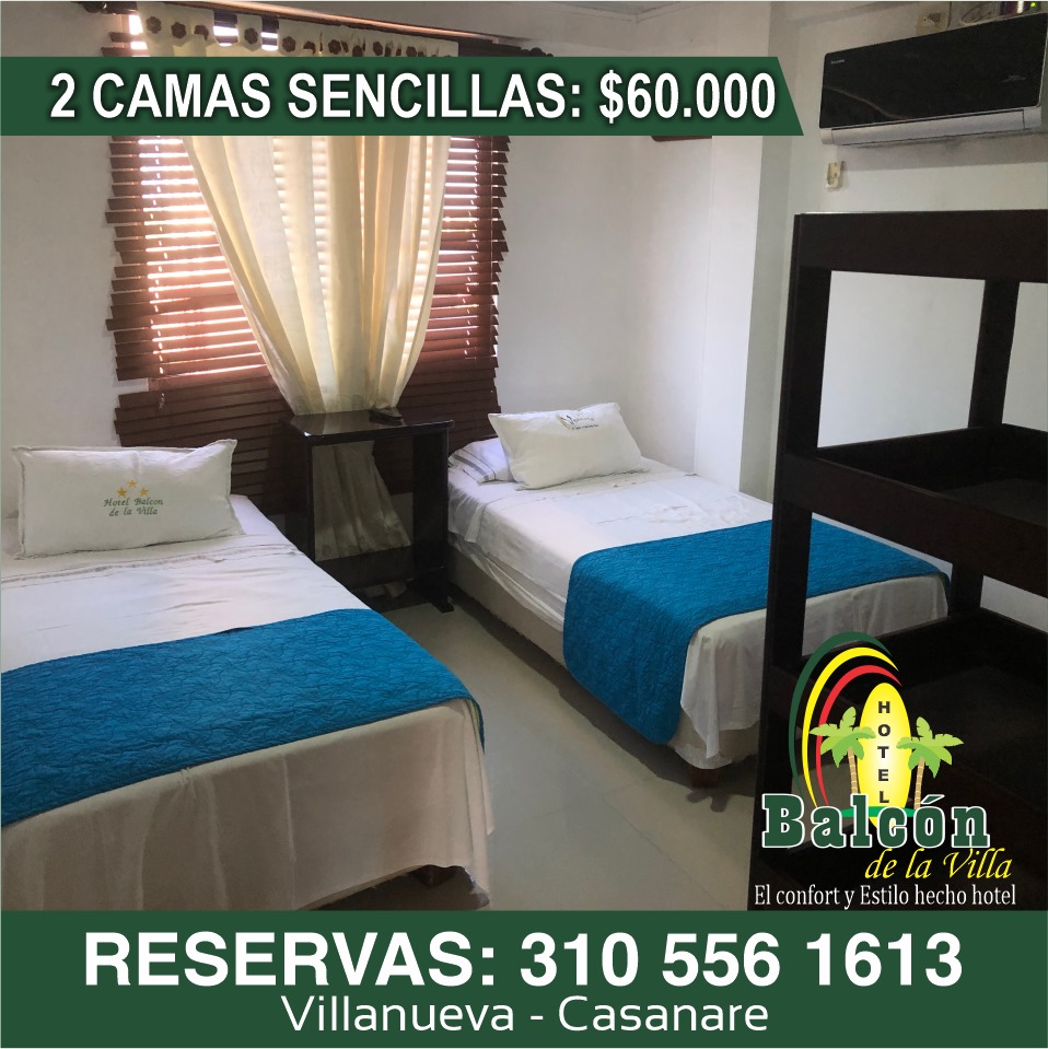 Habitación con camas sencillas del Hotel Balcón de la Villa